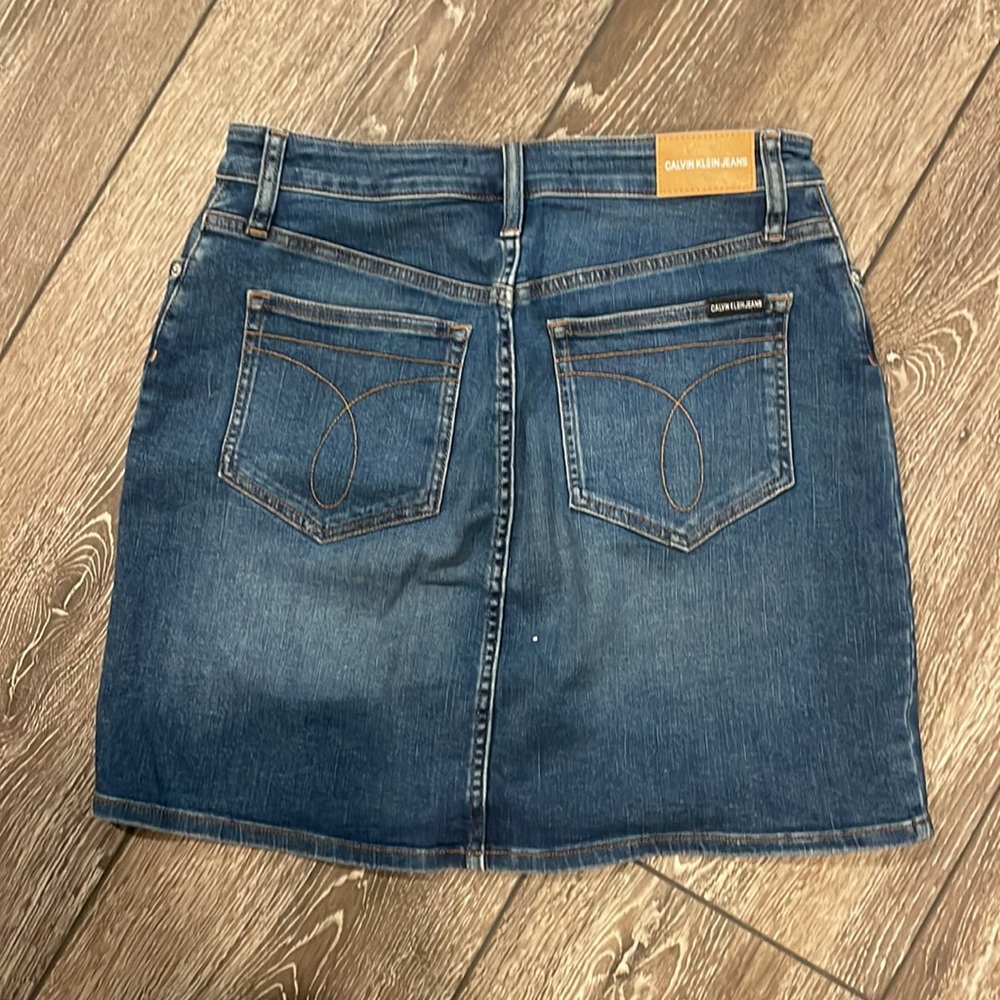 BARELY WORN Dark wash Calvin Klein, jeans skirt, with a few distressed marks - Picture 5 of 5